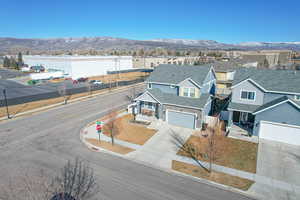 View of front facade featuring a garage and a mountain view