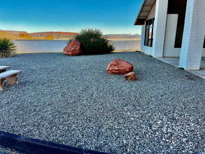 View of yard with a water view