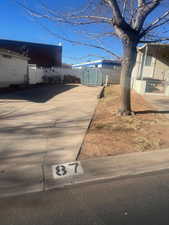 View of yard featuring a storage unit