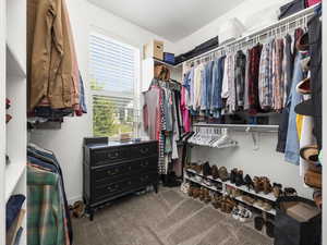 Walk in closet with carpet