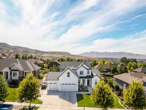 View of front facade featuring a garage and a mountain view