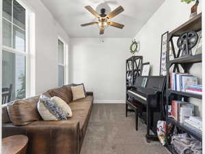 Sitting room with carpet flooring and ceiling fan