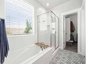 Bathroom with shower with separate bathtub