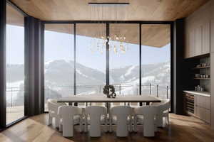 Dining space featuring wood ceiling, a wall of windows, light hardwood / wood-style floors, a mountain view, and beverage cooler