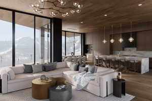 Living room with a mountain view, wood ceiling, a wall of windows, and light hardwood / wood-style floors