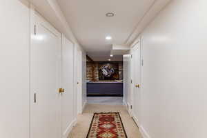 Hallway with light carpet