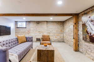 Living room featuring beamed ceiling