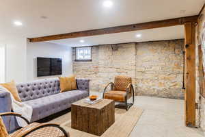 Living room featuring beamed ceiling