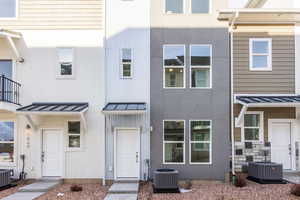 View of front of home featuring central AC