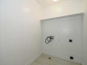 Washroom with hookup for an electric dryer and washer hookup