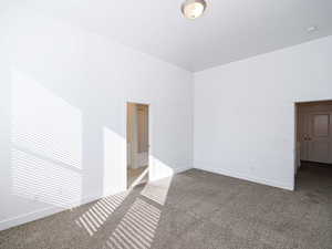 Unfurnished room with light colored carpet