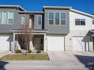 View of property featuring a garage