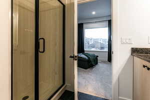 Bathroom with vanity and an enclosed shower