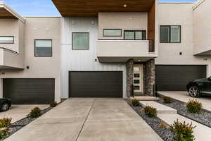 View of front facade featuring a garage