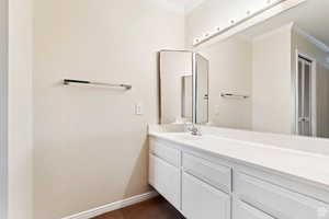 Master Suite #2 Bathroom featuring vanity and ornamental molding