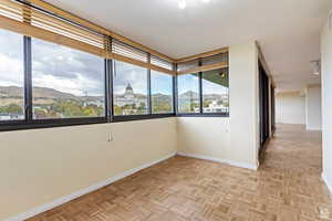 Empty room with a mountain & State Capitol View   and light parquet flooring