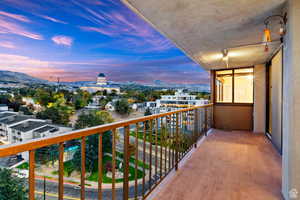 Balcony at dusk with a mountain view