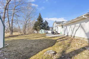 View of yard with a shed.