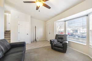 Living room with vaulted ceiling.