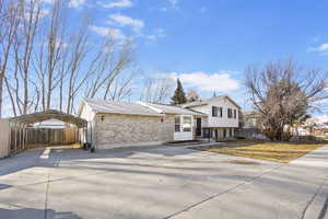 Front of property featuring a carport