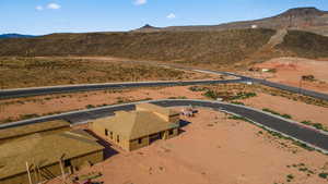 Birds eye view of property with a mountain view