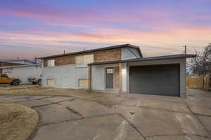 View of front of property featuring a garage