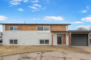 View of front of property with a garage