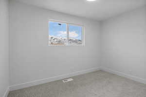 Empty room with carpet flooring