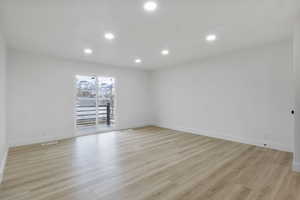 Spare room featuring light hardwood / wood-style flooring