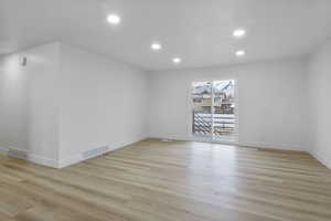 Unfurnished room with light wood-type flooring