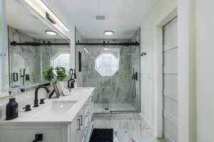 Primary Bathroom with vanity and an enclosed shower