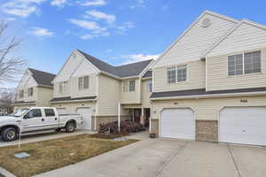 View of property with a garage