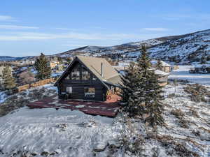 Snow covered property featuring a mountain view