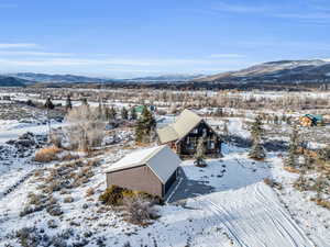 Snowy aerial view with a mountain view