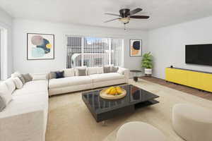 Living room featuring ceiling fan