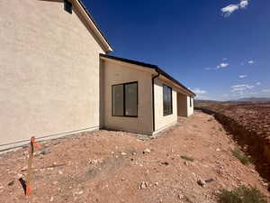 View of property exterior featuring stucco siding