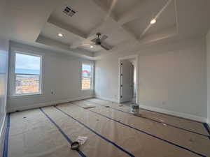 Unfurnished bedroom featuring coffered ceiling, recessed lighting, a ceiling fan, and beam ceiling