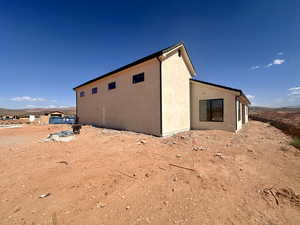 View of property exterior featuring stucco siding