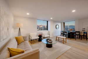 Living room with light hardwood / wood-style flooring