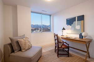 Office featuring a mountain view and light wood-type flooring