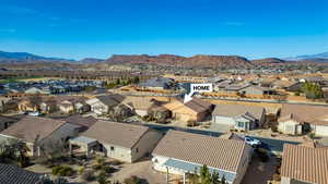 Birds eye view of property with a mountain view