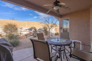 View of patio with ceiling fan and a grill