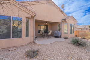 Rear view of house with a patio area and ceiling fan