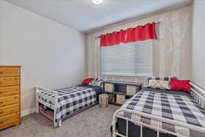 Bedroom featuring carpet floors