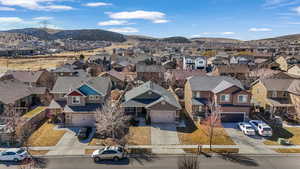 Drone / aerial view featuring a mountain view and a residential view