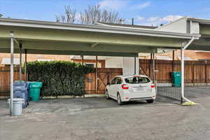 View of car parking featuring a carport