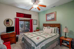 Bedroom with light carpet and ceiling fan