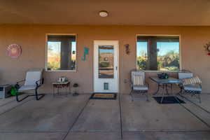 Doorway to property with a patio