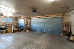 Garage featuring a garage door opener