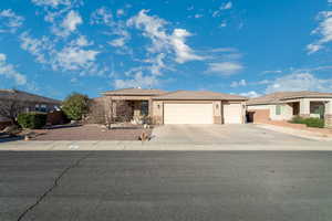 View of front of property featuring a garage